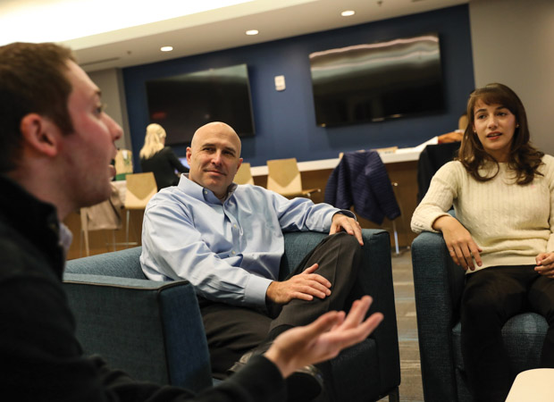 Liberty Mutual’s Robert Taylor (above, center) with Suffolk Law students