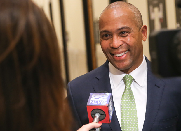 Deval Patrick being interviewed by suffolk alumna